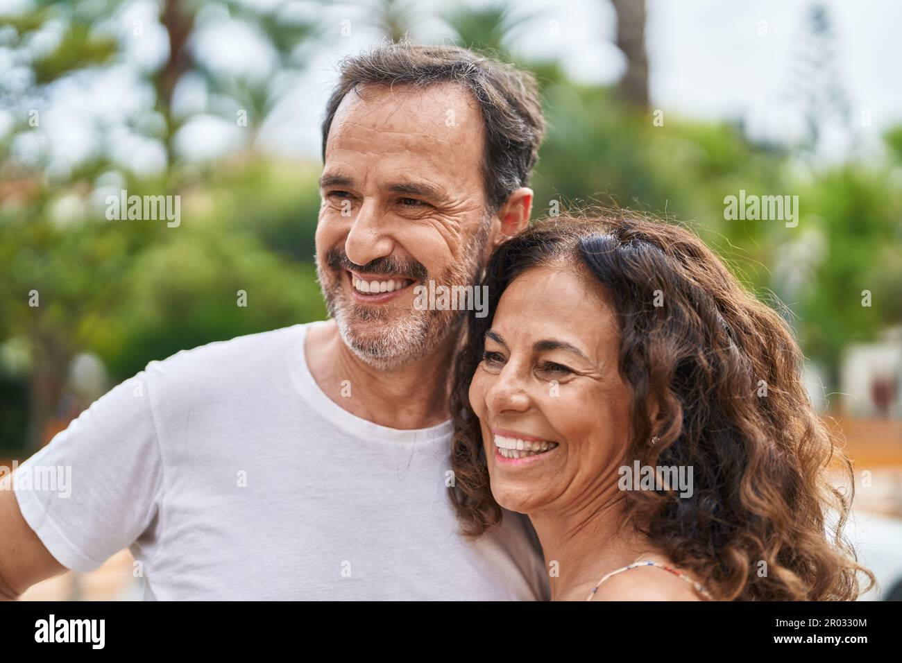 Man and woman couple smiling confident standing together at park Stock ...