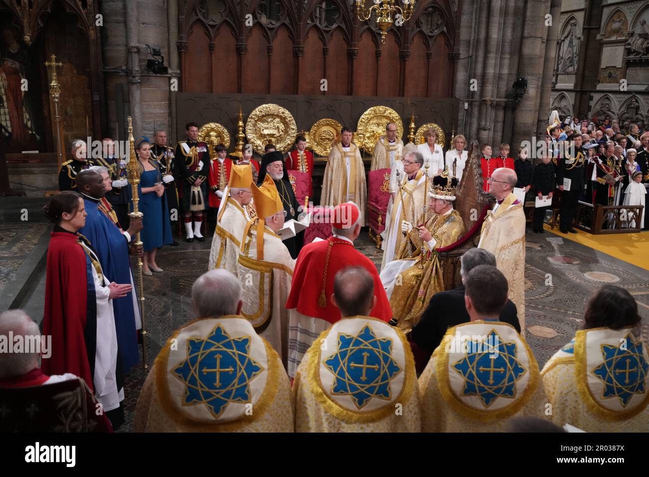 King Charles III crowned with St Edward's Crown and surrounded by faith