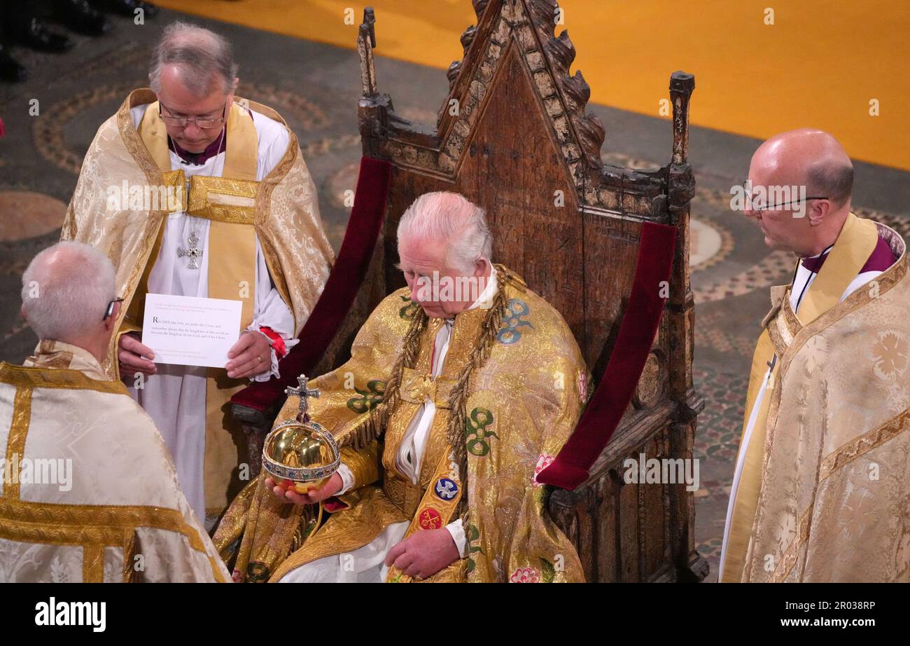 King Charles III holds the Sovereign's Orb during his coronation