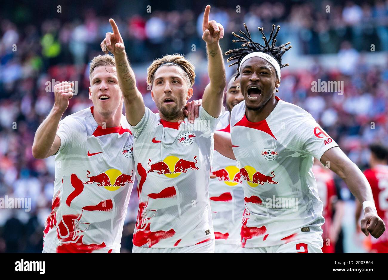 Freiburg Im Breisgau, Germany. 06th May, 2023. Soccer: Bundesliga, SC Freiburg - RB Leipzig, Matchday 31, Europa-Park Stadion. Leipzig's Kevin Kampl (center) celebrates with Leipzig's Daniel Olmo Carvajal (l) and Leipzig's Mohamed Simakan (r) after scoring the 0:1 goal. Credit: Tom Weller/dpa - IMPORTANT NOTE: In accordance with the requirements of the DFL Deutsche Fußball Liga and the DFB Deutscher Fußball-Bund, it is prohibited to use or have used photographs taken in the stadium and/or of the match in the form of sequence pictures and/or video-like photo series./dpa/Alamy Live News Stock Photo