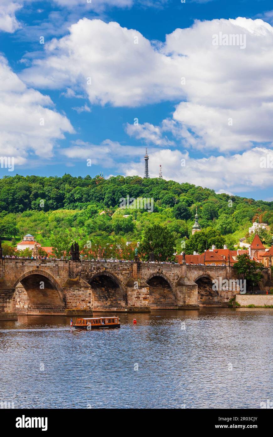 View of River Vltava with iconic Charles Bridge and Petrin Hill in Prague Stock Photo