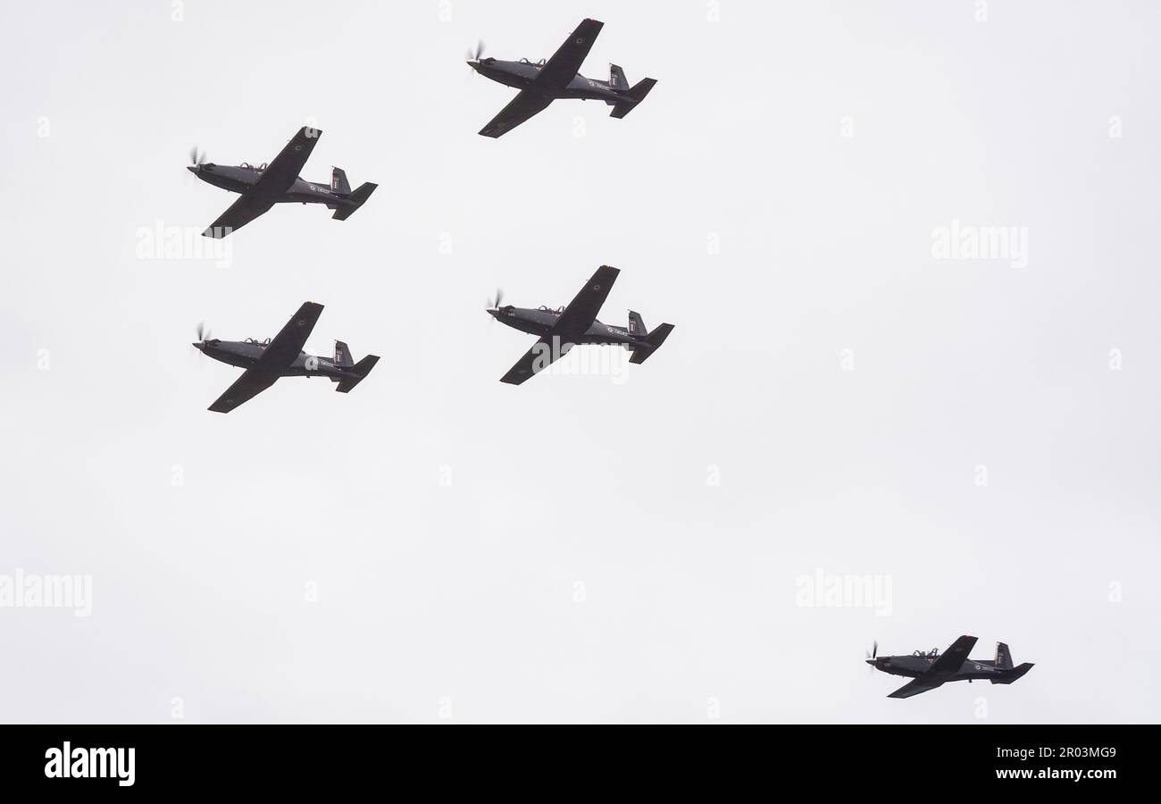 A flight of Raytheon Texan T.1 aircraft from 72(R) Squadron, RAF Valley, undertake a flypast of The Racecourse, home of Wrexham Football Club, to commemorate the Coronation of King Charles III and the team's recent promotion to the Football League. Stock Photo