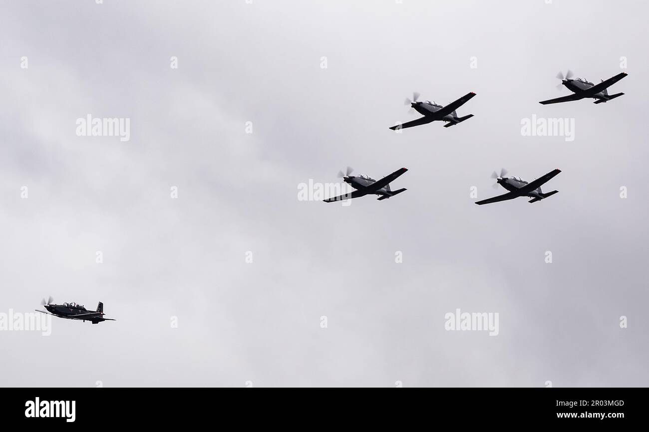 A flight of Raytheon Texan T.1 aircraft from 72(R) Squadron, RAF Valley, undertake a flypast of The Racecourse, home of Wrexham Football Club, to commemorate the Coronation of King Charles III and the team's recent promotion to the Football League. Stock Photo