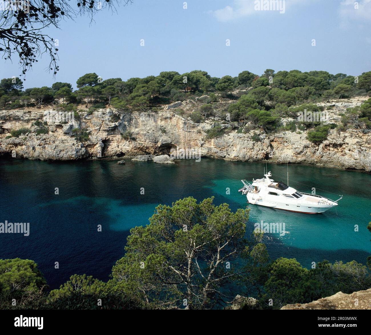 Spain. Balearic Islands. Mallorca. Cala Pi. Luxury boat in bay. Stock Photo