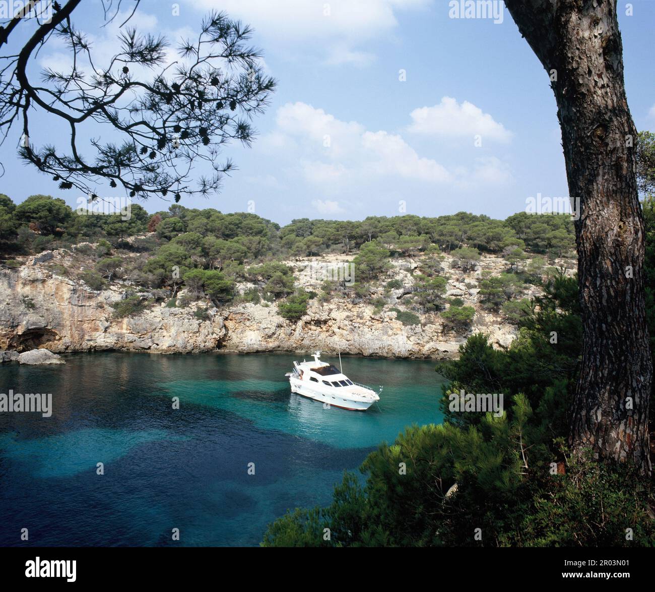 Spain. Balearic Islands. Mallorca. Cala Pi. Luxury boat in bay. Stock Photo
