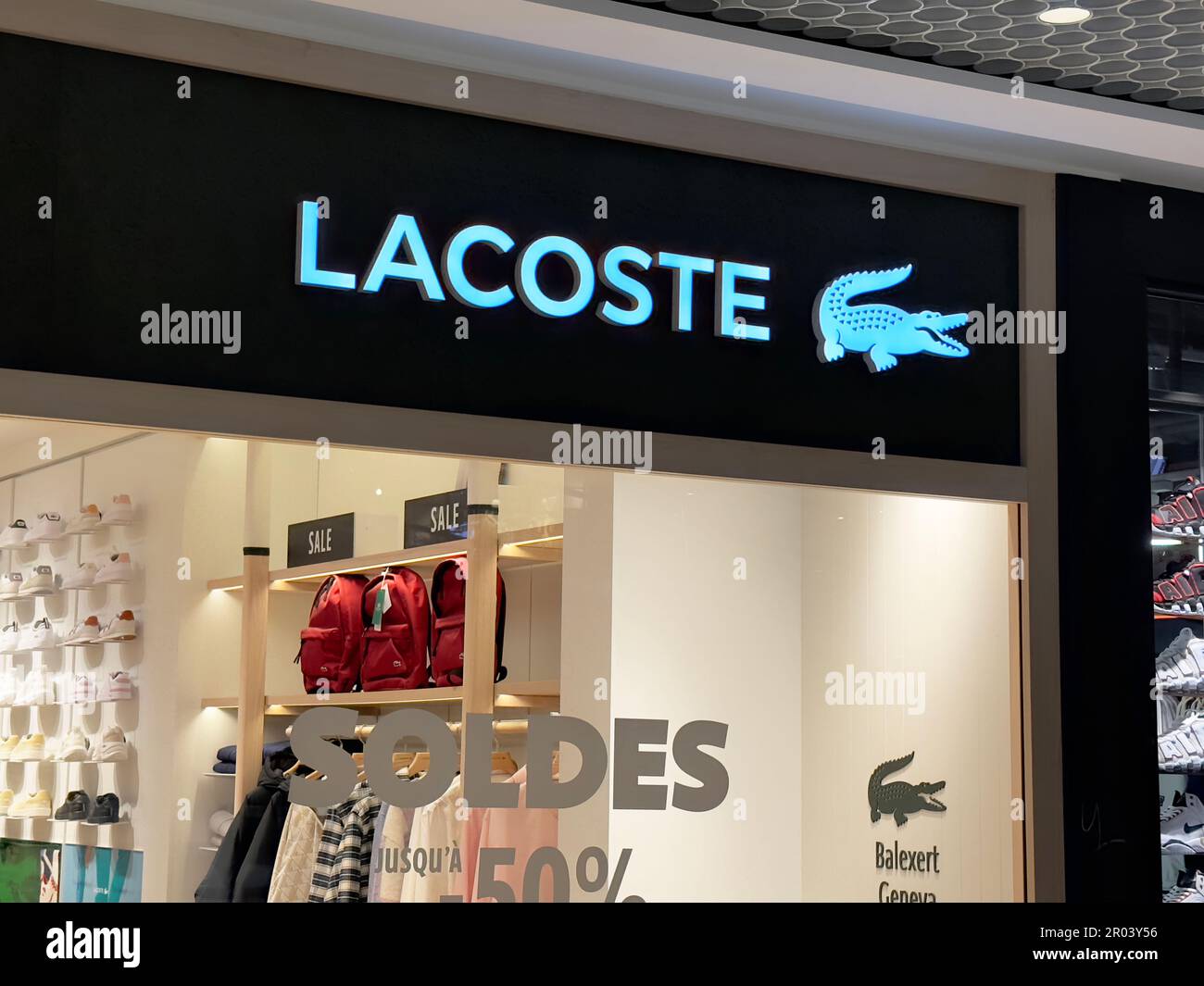 Geneva, Switzerland - Jan 11, 2023: Lacoste store in Geneva. Lacoste S.A. is a French company, founded in 1933 by tennis player René Lacoste. Stock Photo
