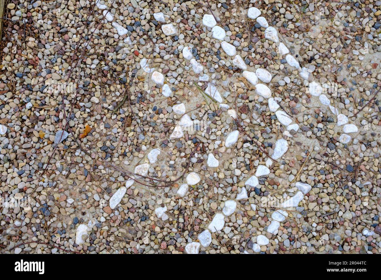 small white stones laid out on the path. directions in the form of ...