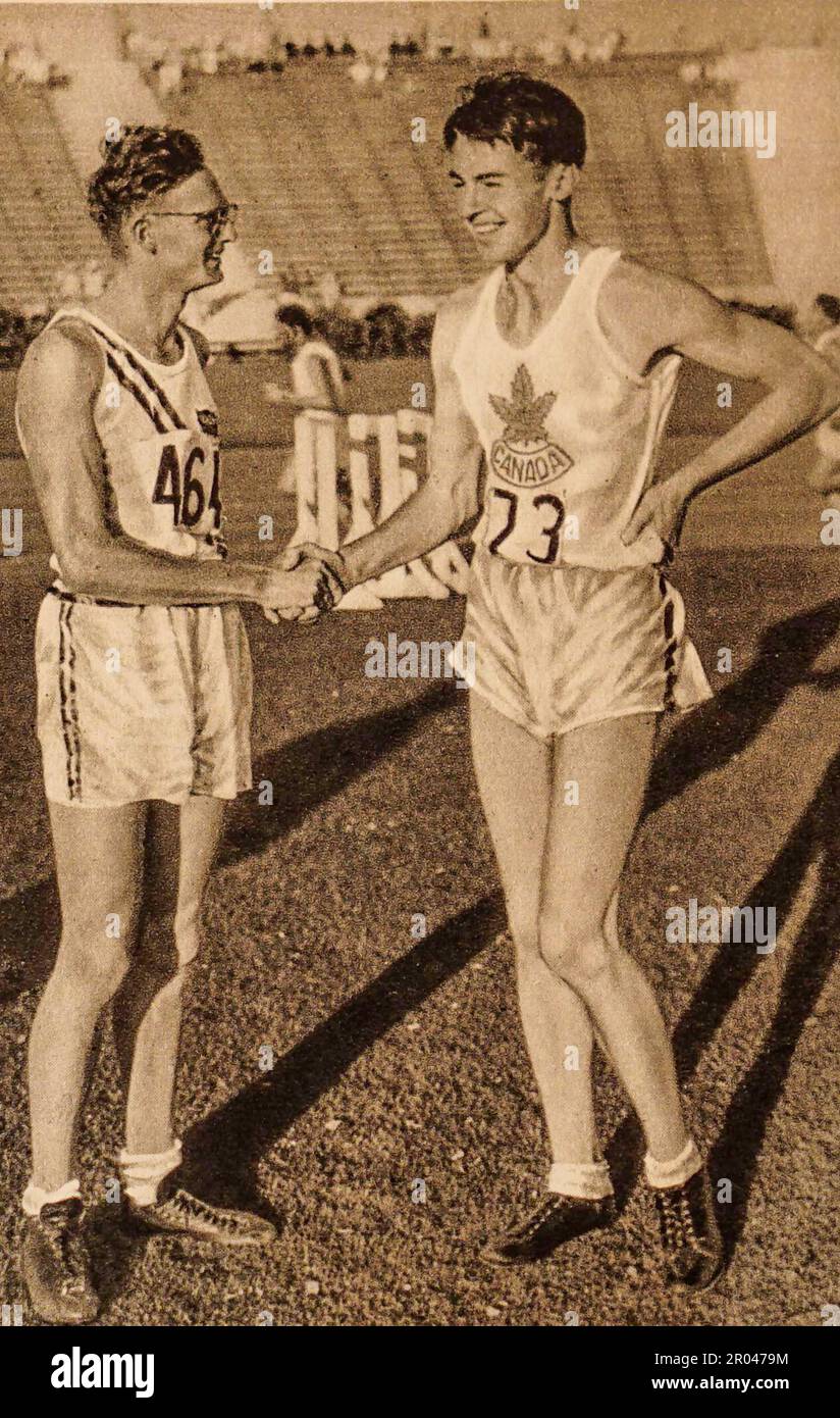 !932 Los Angeles Olympics. The High Jump. Duncan McNaughton (Canada}, gold medalist, is congratulated by Robert Van Osdel, (USA) silver medalist. Stock Photo