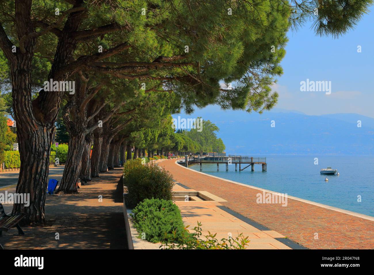 The picturesque embankment of the resort town of Maderno on Lake Garda in Italy. Stock Photo