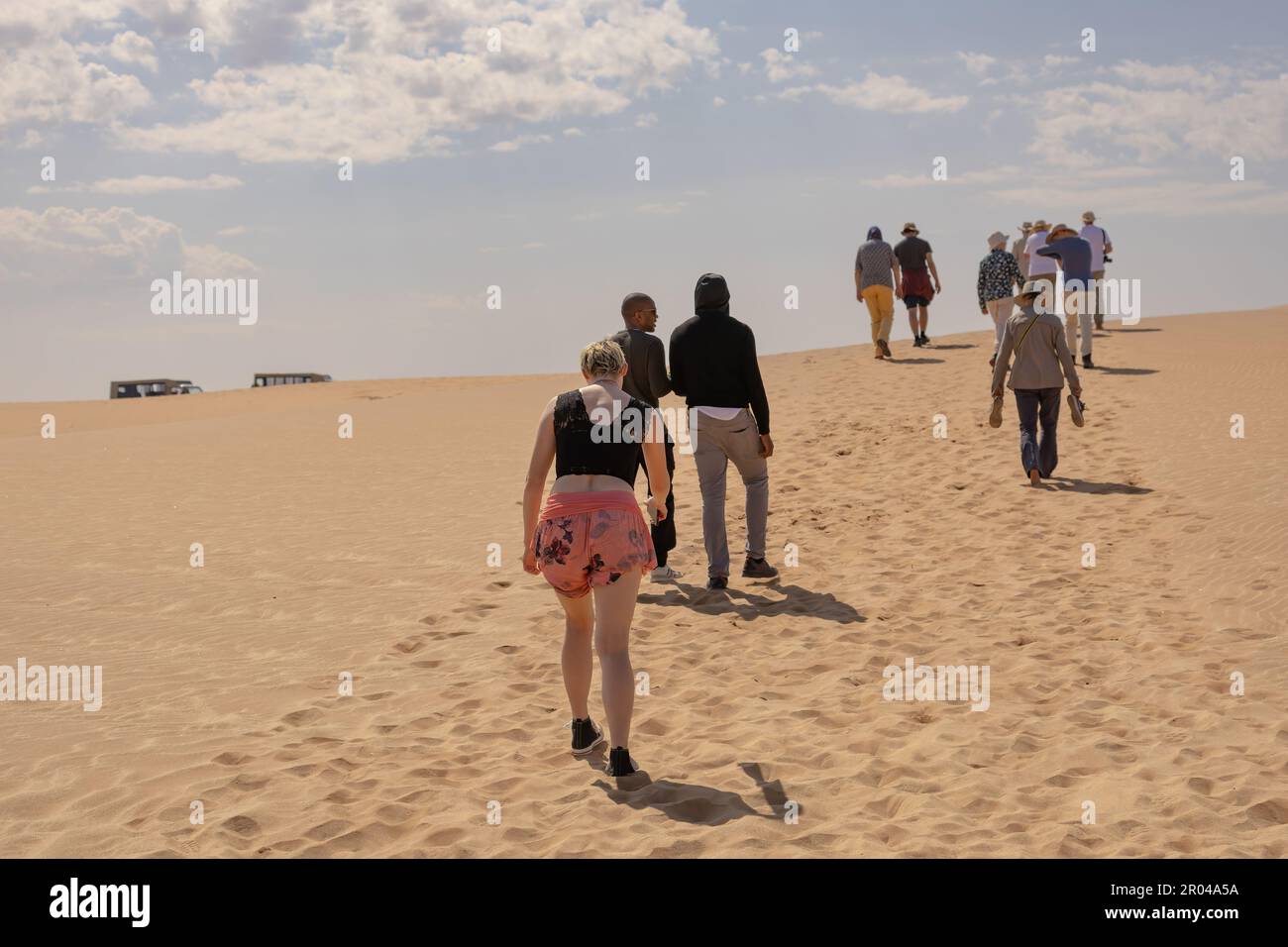 people walking on a dune in Namib desert Stock Photo - Alamy