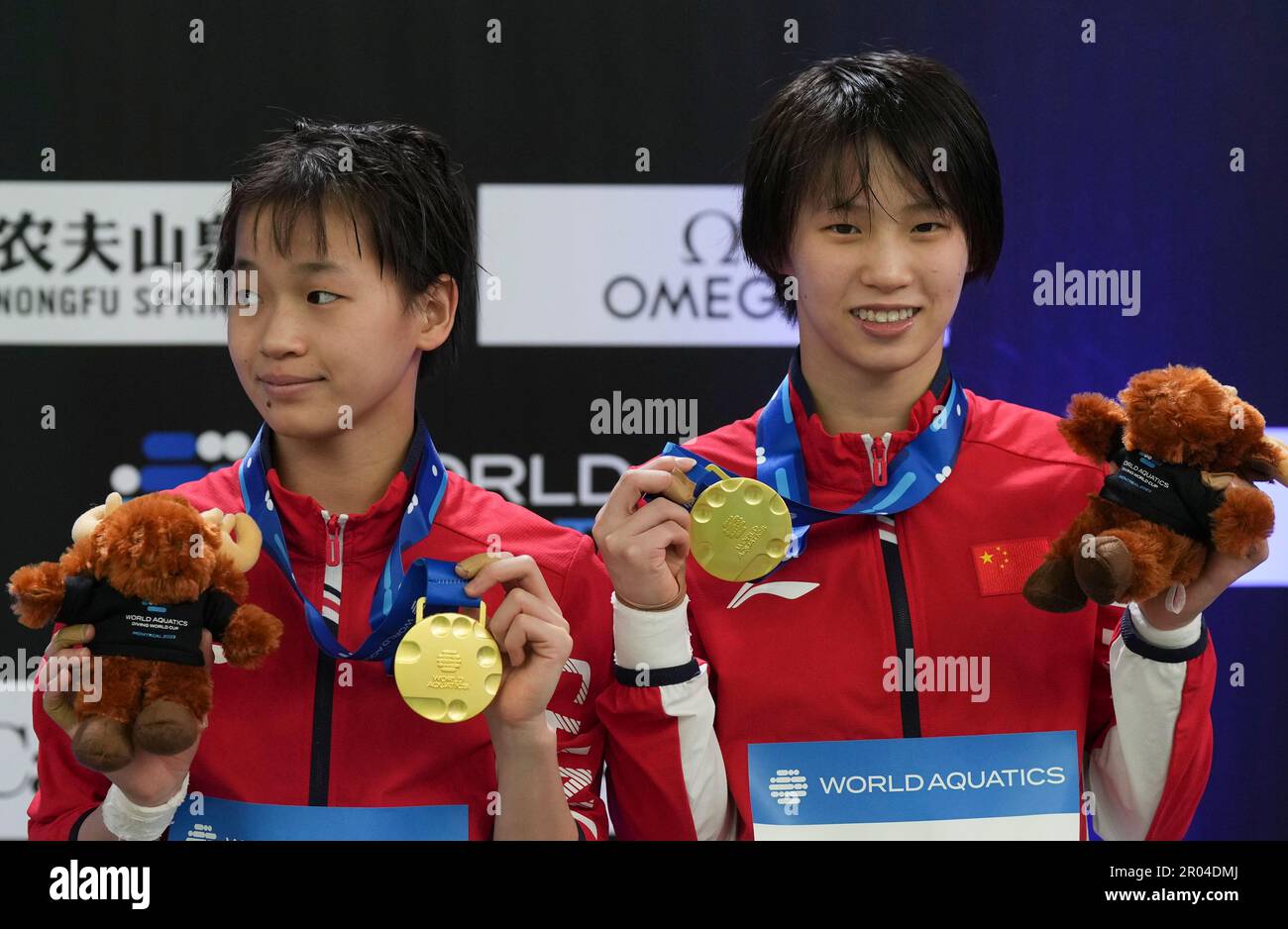 Quan Hongchan, left, and Chen Yuxi, right, of China, pose with their gold medals following the women's 10-meter synchronized platform final at the World Aquatics Diving World Cup in Montreal, Saturday, May 6, 2023. (Christinne Muschi/The Canadian Press via AP) Stock Photo