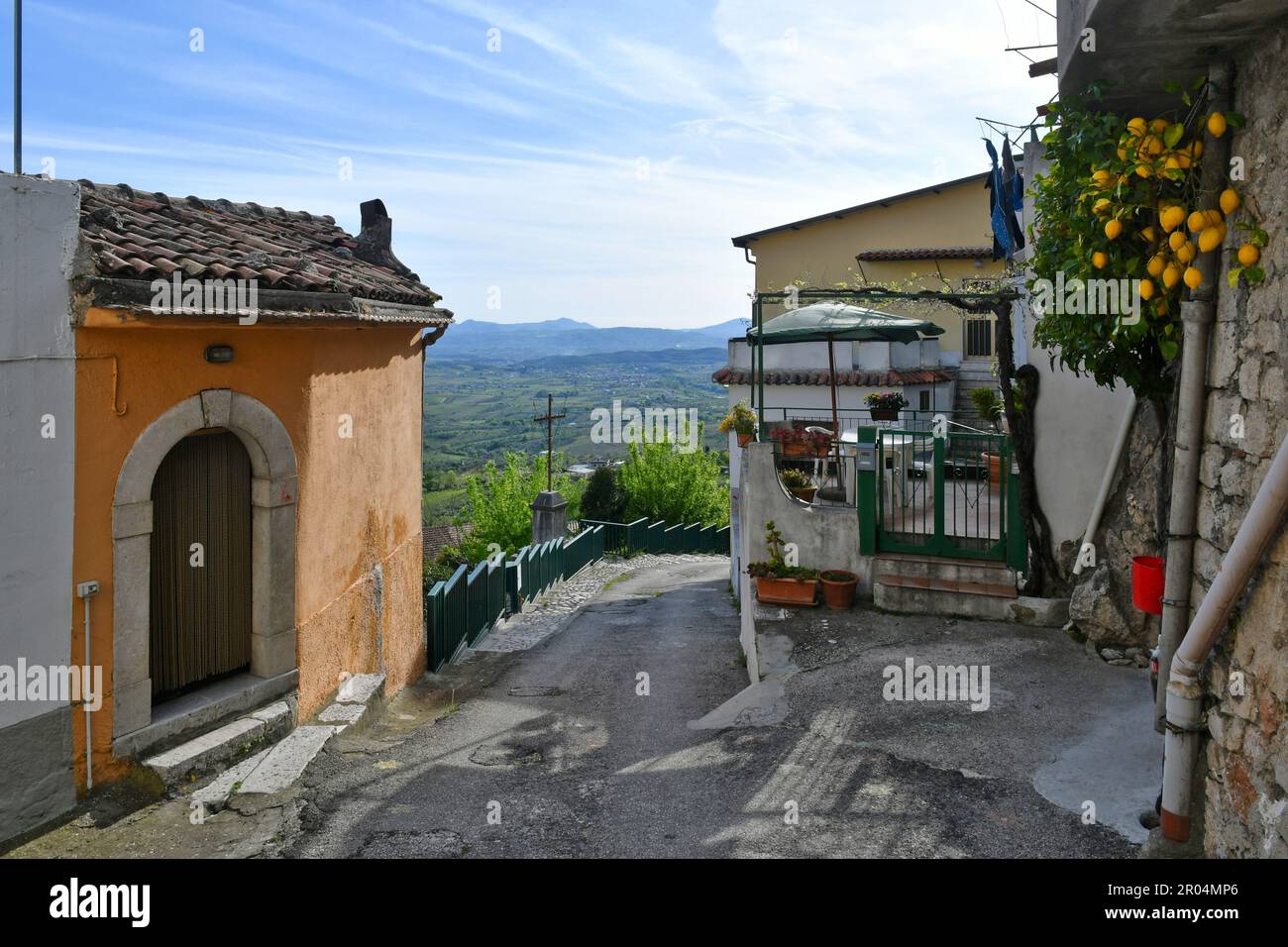 A narrow street among the old houses of Guardia Sanframondi, a small