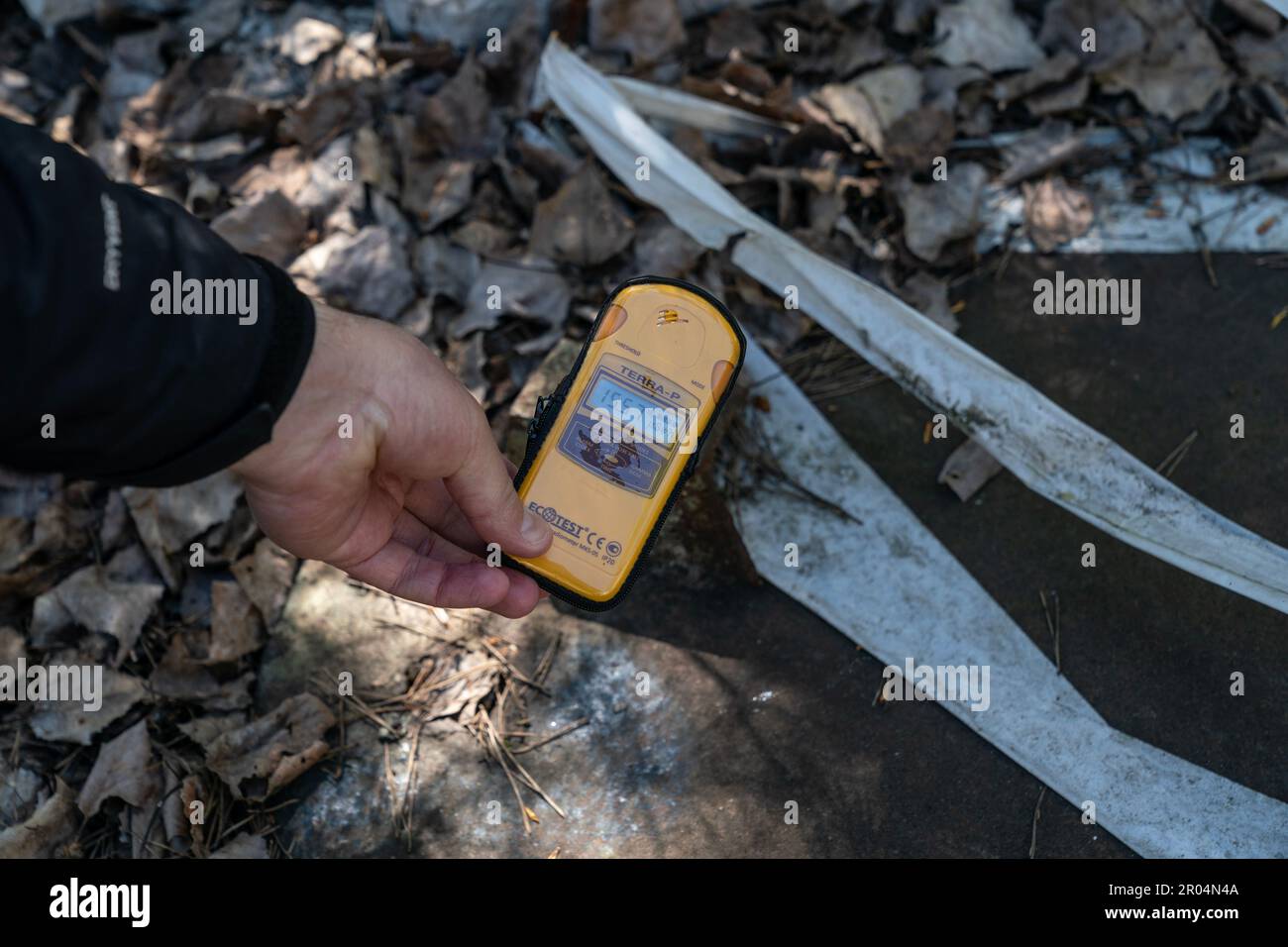A Geiger counter shows radiation level in abandoned city of Pripyat in
