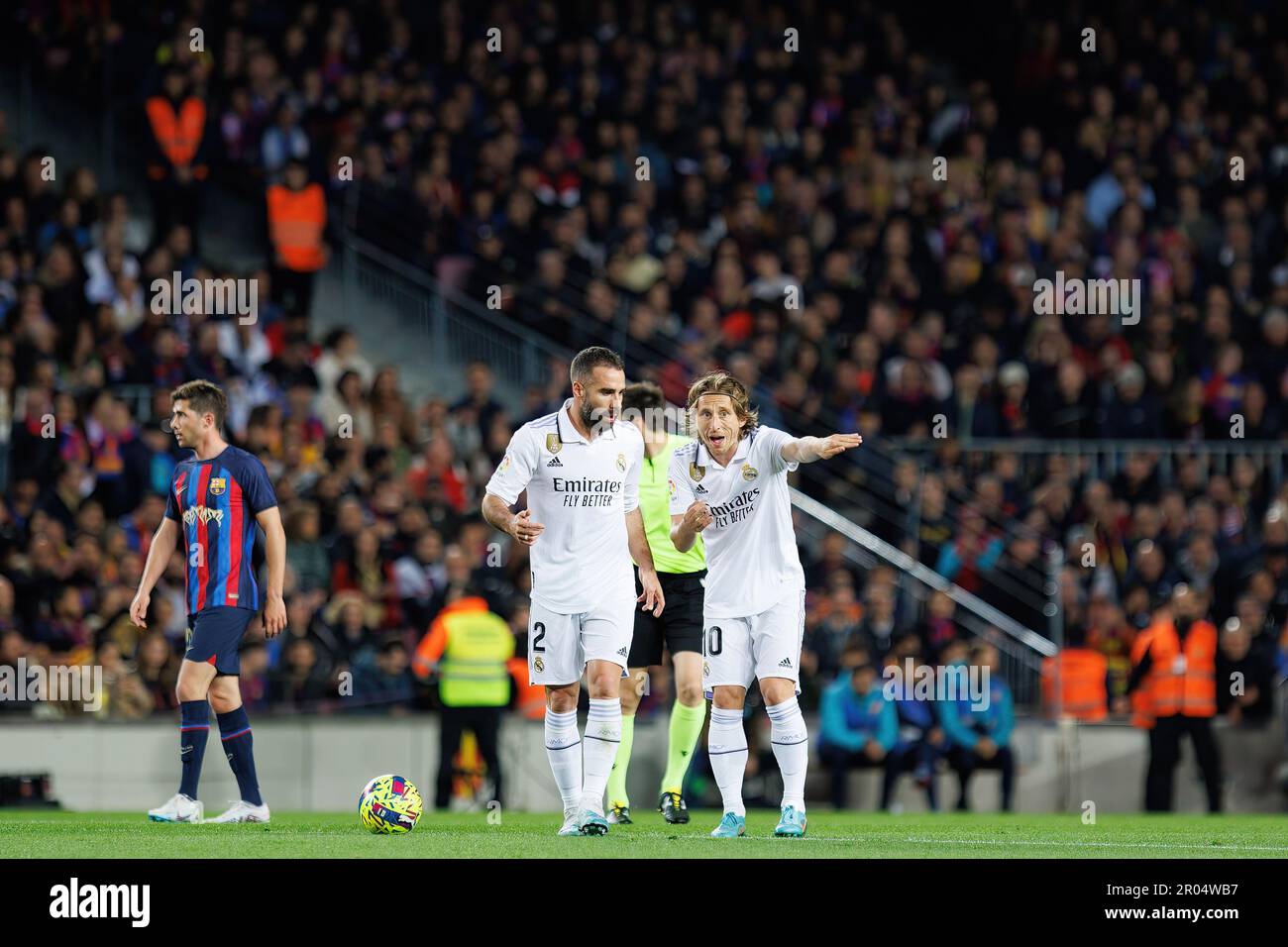 BARCELONA - MAR 19: Carvajal (L) and Modric (R) talk during the LaLiga match between FC Barcelona and Real Madrid at the Spotify Camp Nou Stadium on M Stock Photo