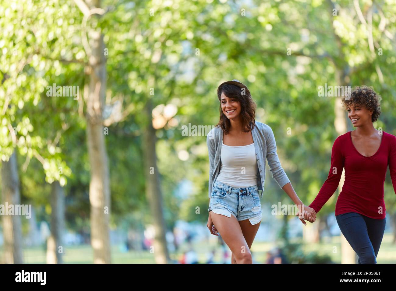Strolling and living life one step at a time. a young couple spending the day outdoors on a sunny day. Stock Photo