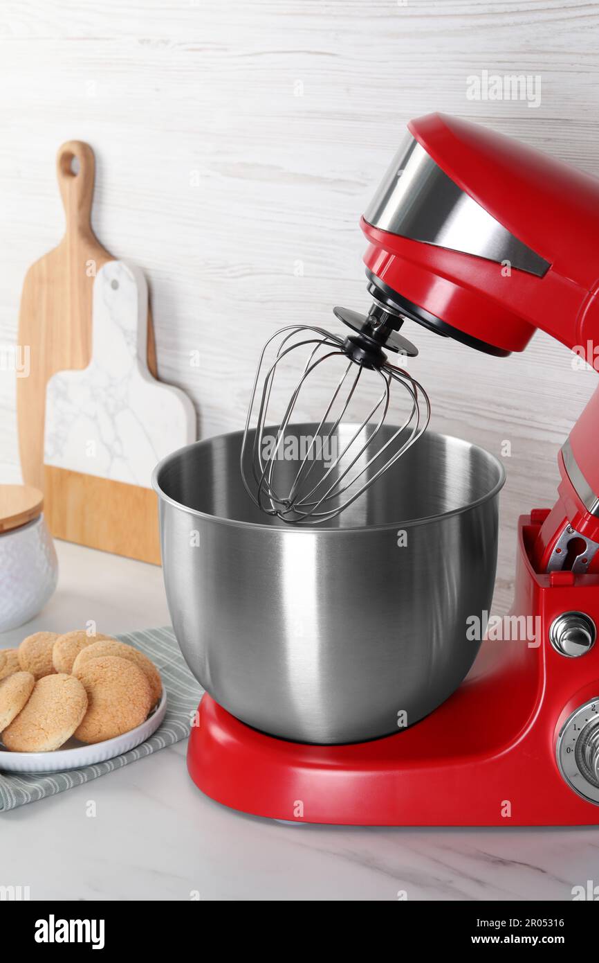https://c8.alamy.com/comp/2R05316/modern-red-stand-mixer-and-cookies-on-white-marble-table-2R05316.jpg