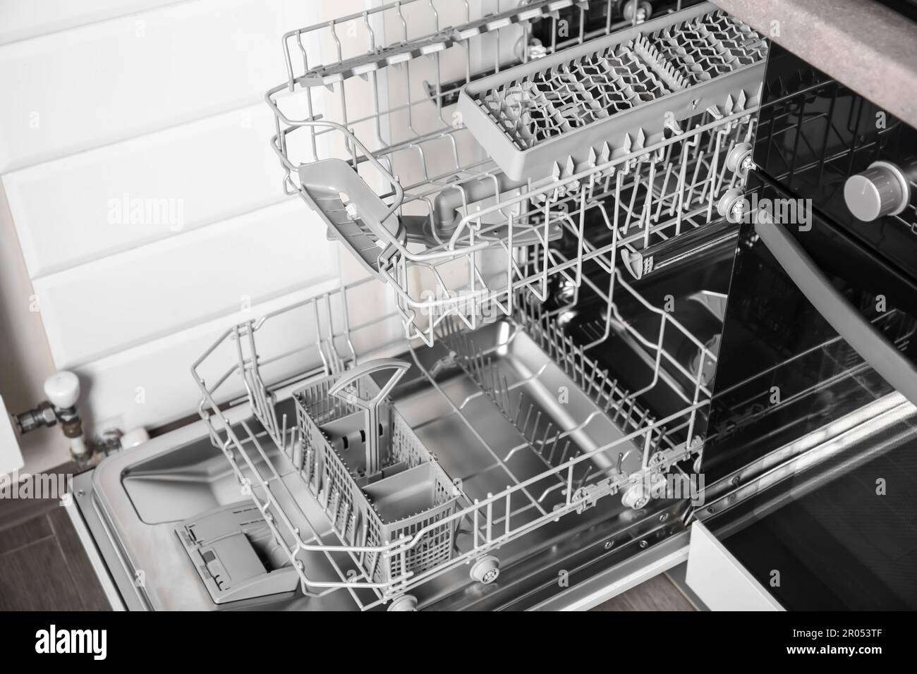 Open clean empty dishwasher in kitchen, closeup Stock Photo Alamy