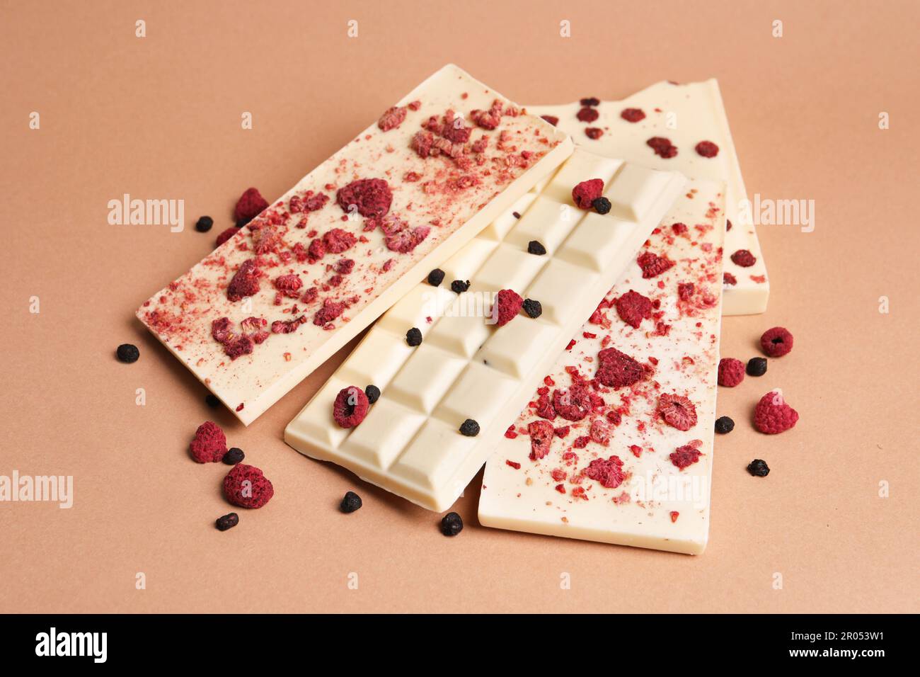 White chocolate bars with freeze dried fruits on beige background Stock ...