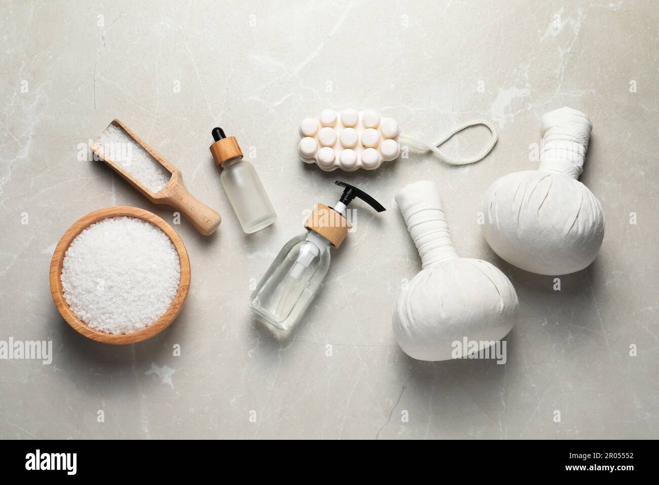 Flat lay composition with herbal massage bags and other spa products on ...