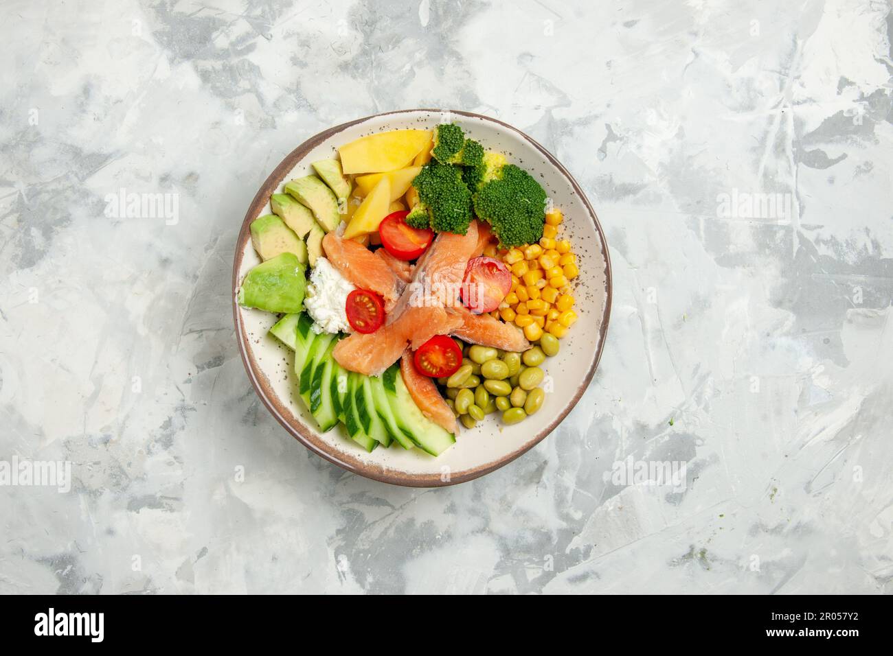 top view delicious fish salad with tomatoes cucumbers beans and cheese