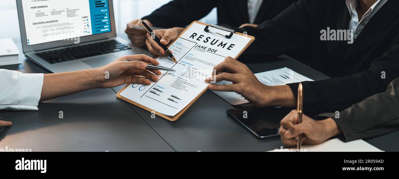 Candidate and interviewers discuss work experience and qualifications