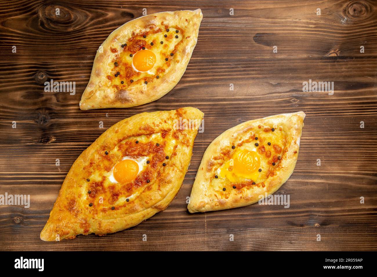 top view baked egg breads fresh off the oven on brown desk dough eggs