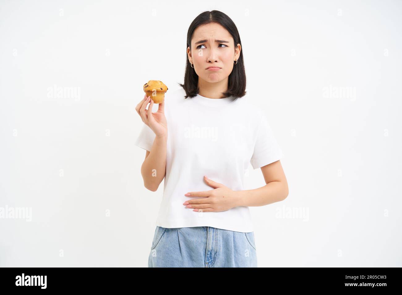 Woman eating cake pain hires stock photography and images Alamy