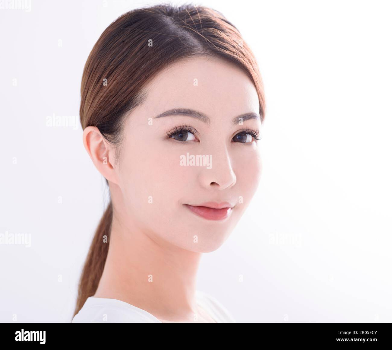 Beautiful young asian woman with clean fresh skin on white background Stock Photo