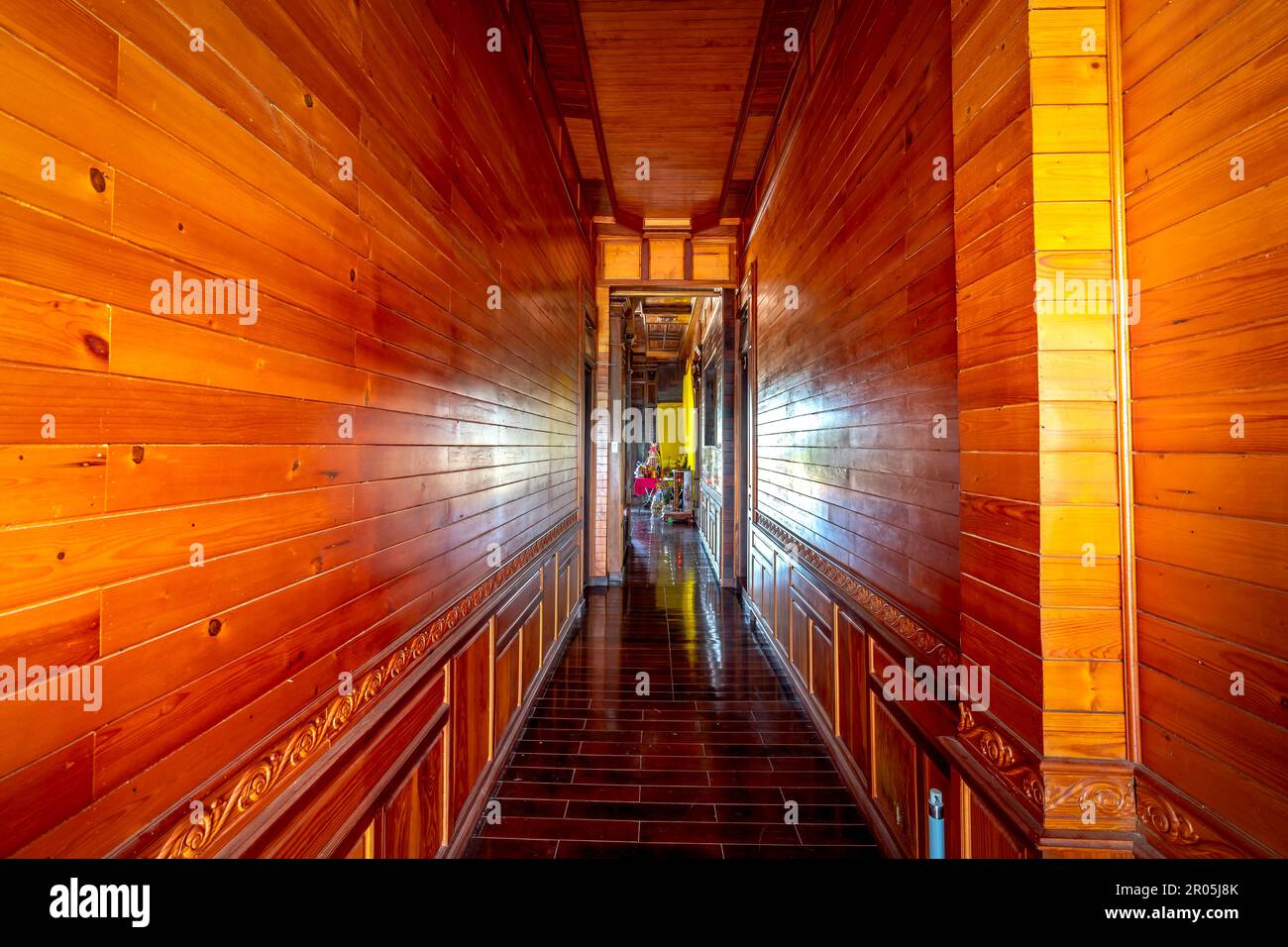 A view of the interior of a room decorated entirely with wood in ...
