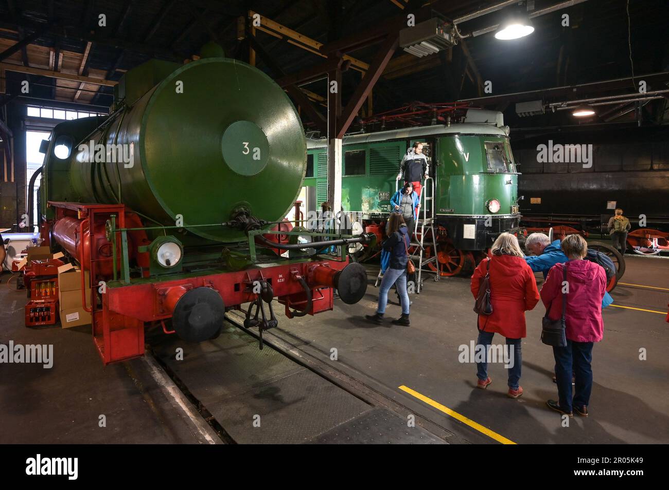 06 May 2023, Saxony-Anhalt, Halle (Saale): An electric locomotive from 1937 stands in the locomotive shed of the Deutsche Bahn Museum Halle to be explored by visitors inside and out. The joint Museum Night of the cities of Halle and Leipzig invited 85 museums, galleries and collections. Photo: Heiko Rebsch/dpa Stock Photo