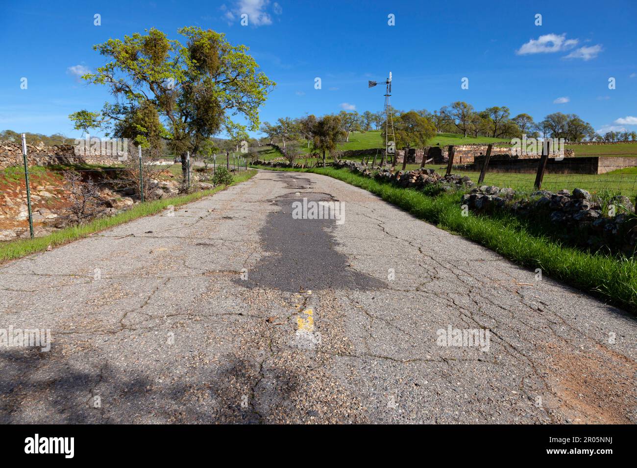 A bypassed section of California Highway 4 roadbed passes the ghost town of Telegraph City in the foothills of Calavaras County. Stock Photo