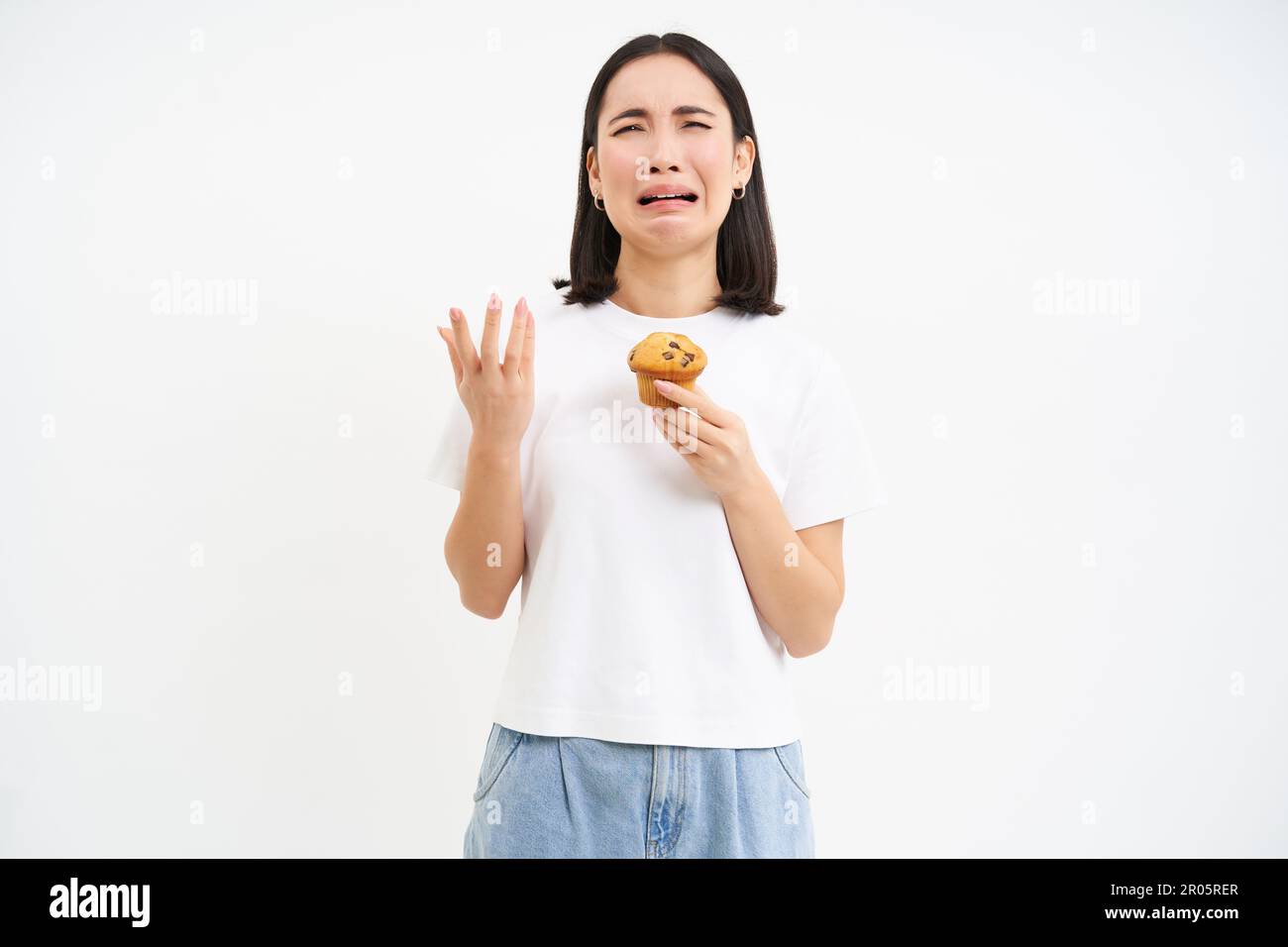 Sweets Sad Portrait of miserable girl with cupcake, sad without sweets, cant eat ...