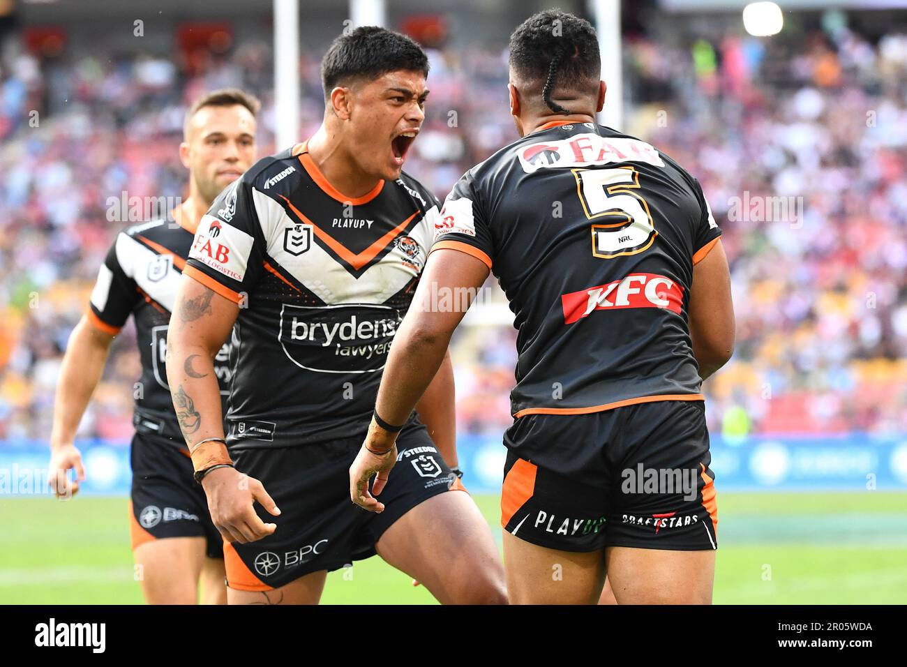 Tommy Talau and Junior Tupou of the Tigers celebrate a Tupou try during the NRL Round 10 match Tommy Talau and Junior Tupou of the Tigers celebrate a Tupou try during the NRL Round 10 match