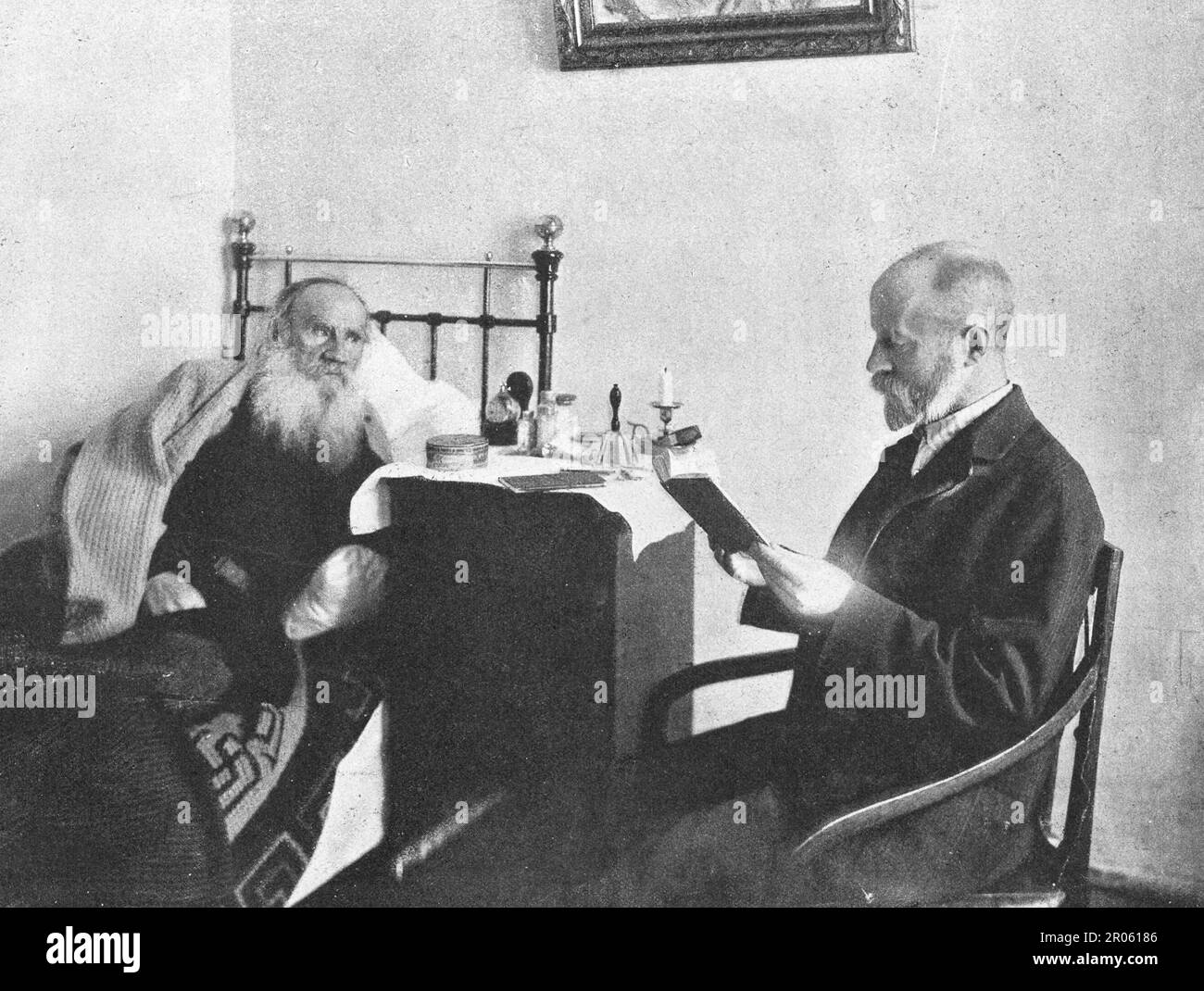 Dr. D. Makovitsky reads a book to Leo Tolstoy. Stock Photo