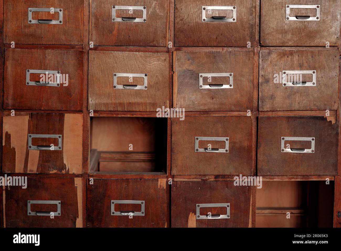 Broken wooden vintage with missing drawers. Library card or