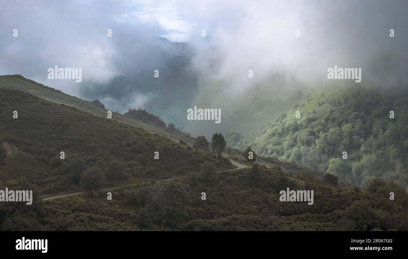 Striking Storm Clouds over Rolling Hills.in Asturias, Spain Stock Photo