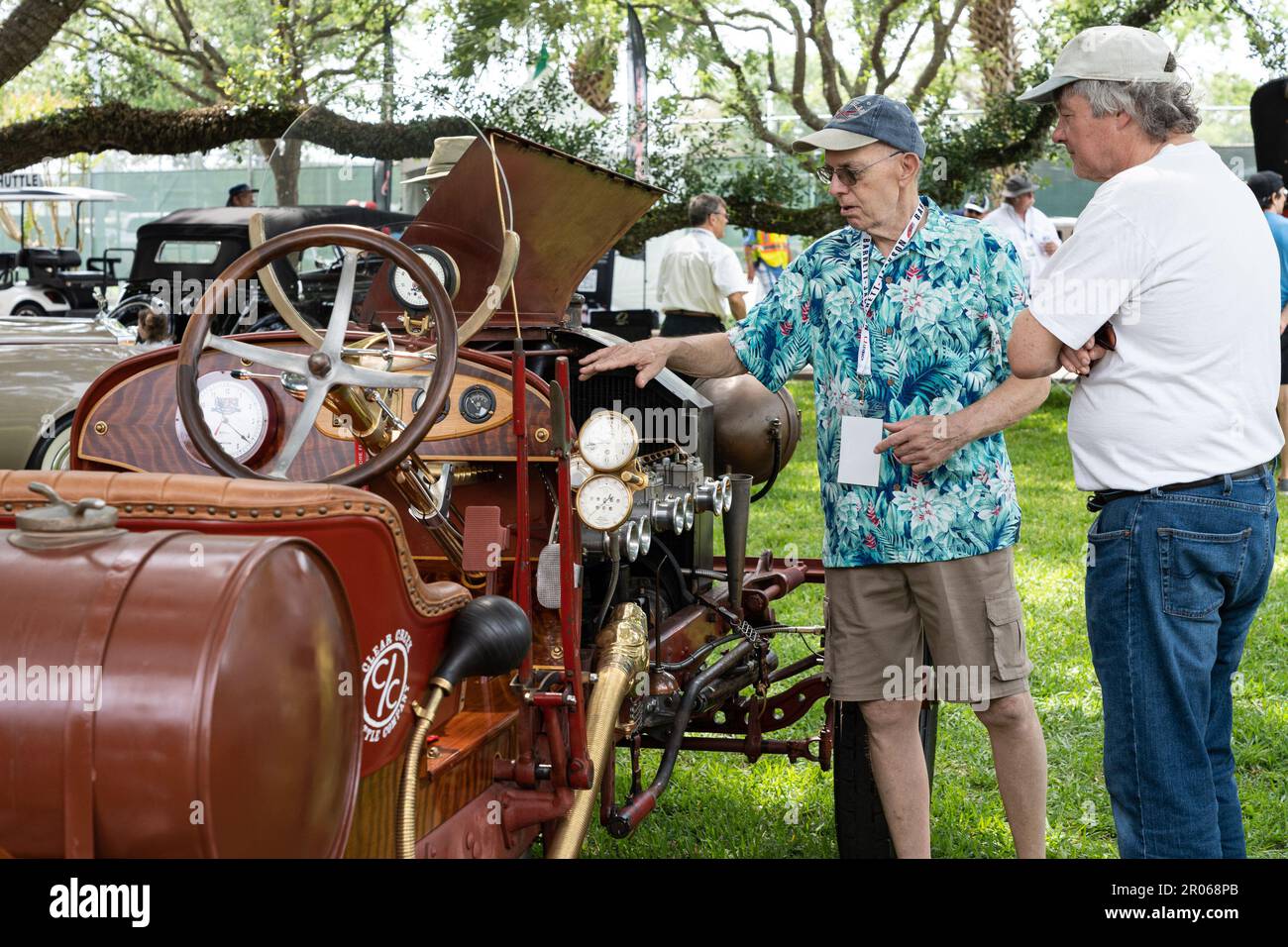 Seabrook, USA. 6th May, 2023. People chat next to an antique car at the