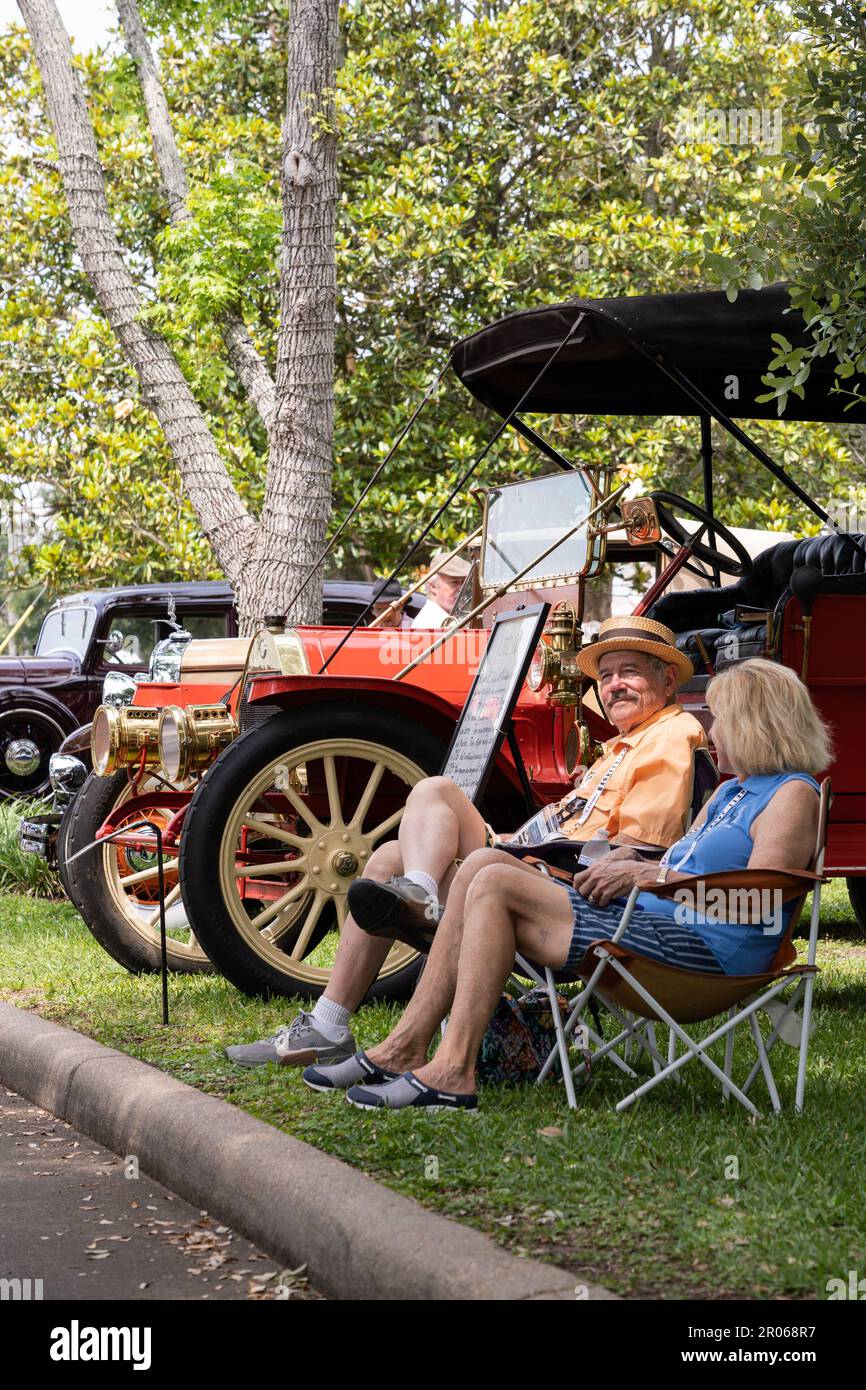 Seabrook, USA. 6th May, 2023. Participants sit next to an antique car