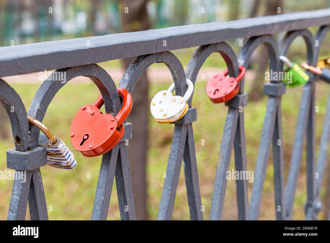 a heart-shaped metal padlock hanging from the railing. lock wedding ...