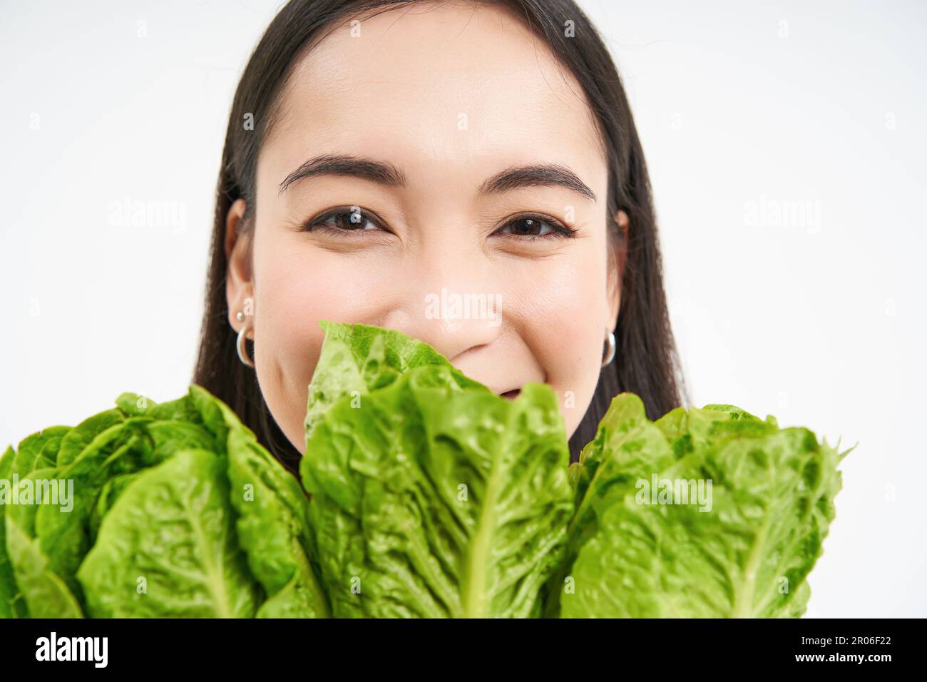 Healthy food and vegan lifestyle. Close up portrait of smiling asian