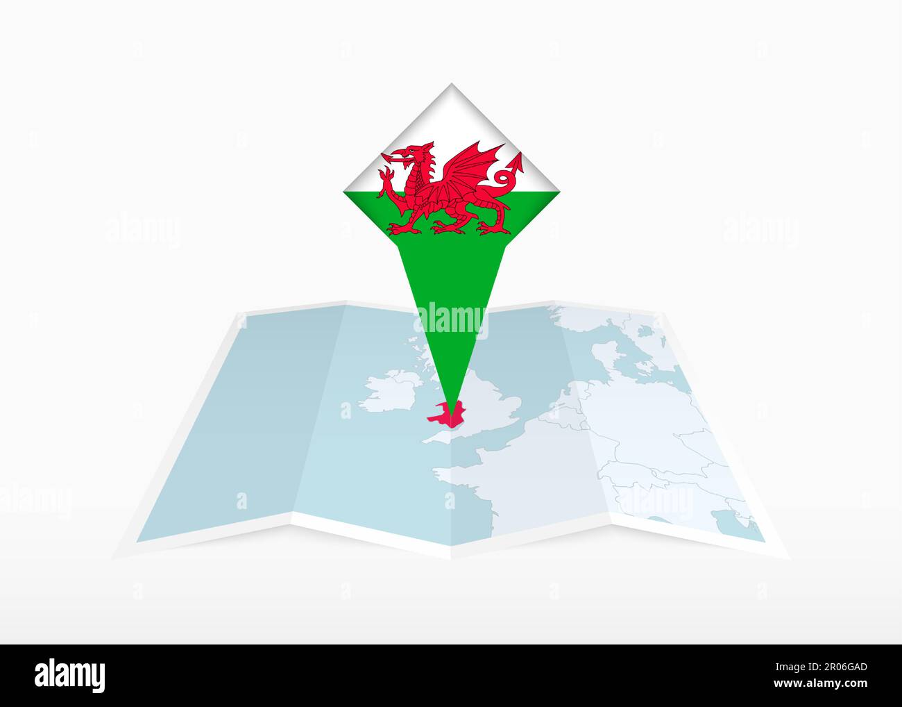 Wales is depicted on a folded paper map and pinned location marker with ...