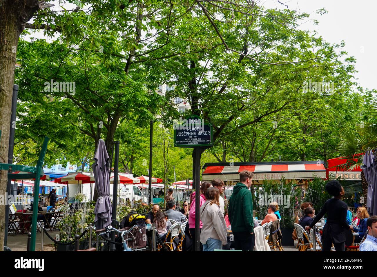 People sitting in outdoor cafes in Montparnasse area at Place Josephine