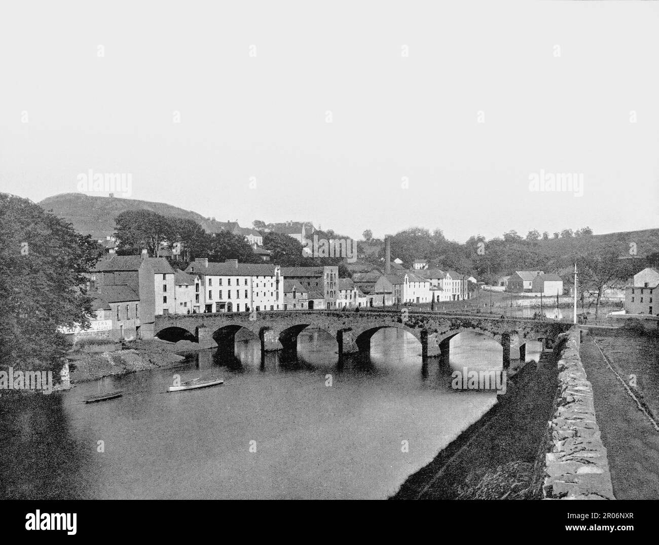 A late 19th century view of Enniscorthy located on the picturesque River Slaney in County Wexford, Ireland. The tower on Vinegar Hill  hill (left background) overlooking the town, was the largest camp and headquarters of the rebels of 1798 who controlled County Wexford for thirty days against vastly superior forces, before their defeat on 21 June. Stock Photo