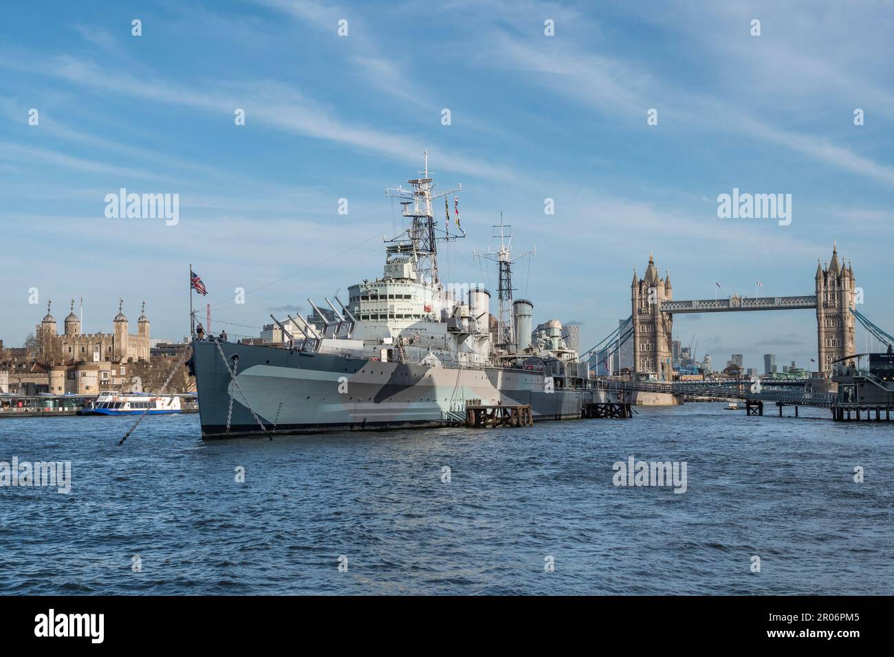 The World War Two cruiser HMS Belfast and Tower Bridge, River Thames, London, UK. Stock Photo