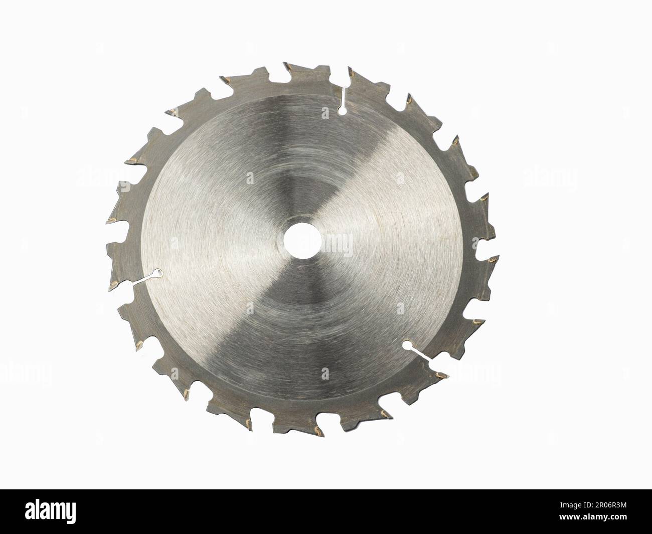 A circular saw blade cropped against white background. Close up. Stock Photo