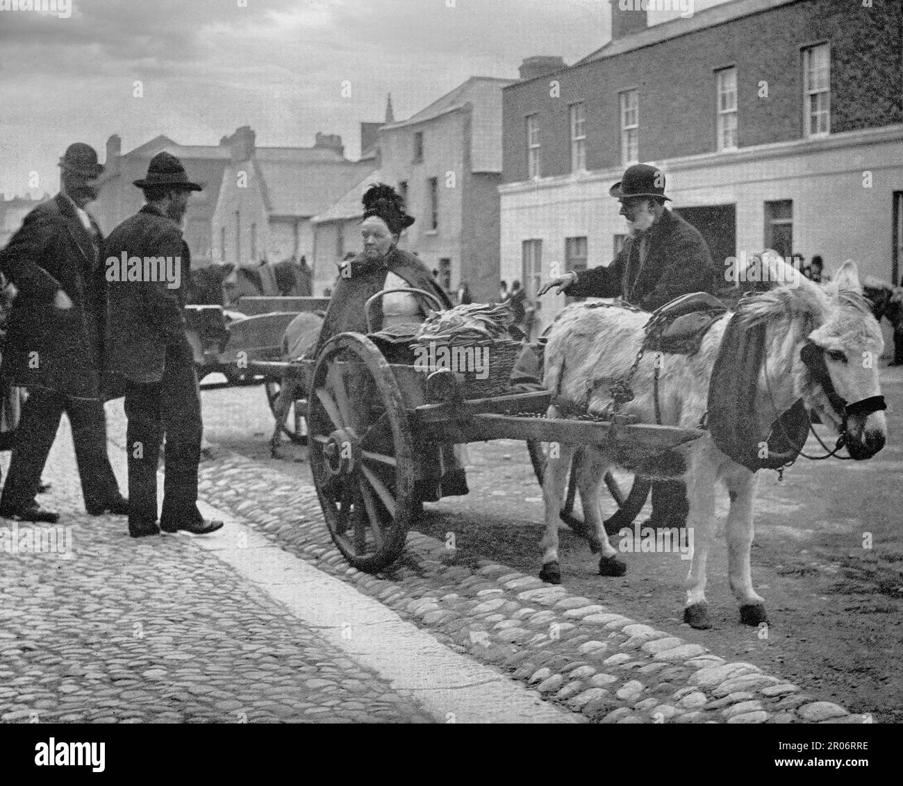 A late 19th century view of a market donkey a street trader during market day in Drogheda, County Louth on the east coast of Ireland. Stock Photo
