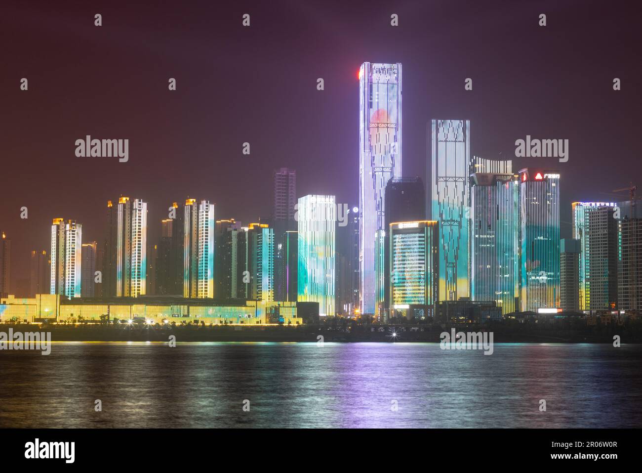 night view of high-rise buildings along Liuyang River near the junction with Xiangjiang river, Changsha, Hunan, China Stock Photo