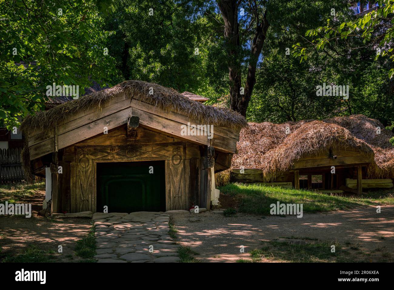 half-buried or underground houses in Dimitrie Gusti National Village Museum in Bucharest, Romania Stock Photo