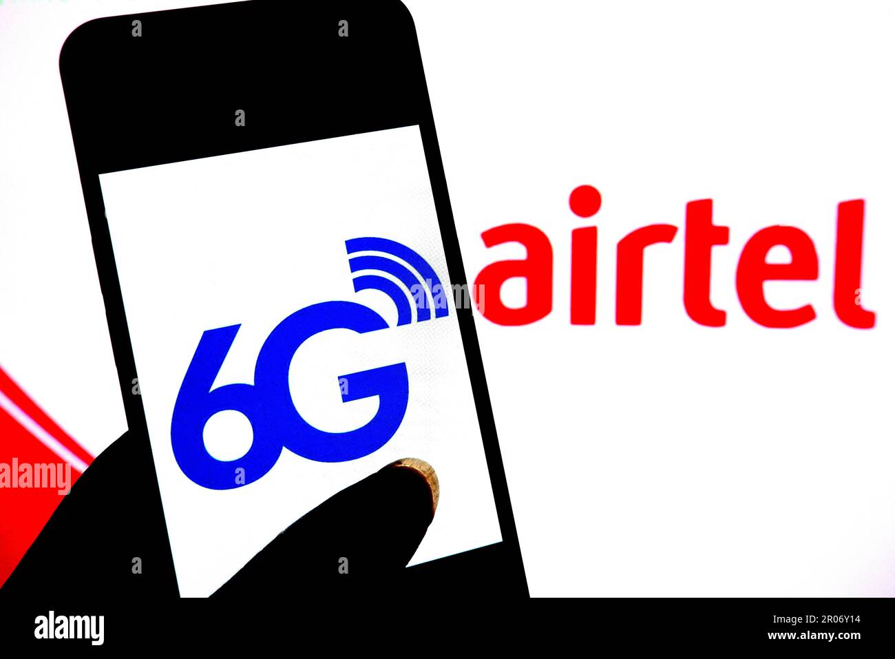 In this photo illustration, a 6G logo is seen displayed on a smartphone with an Airtel logo in the background. Stock Photo