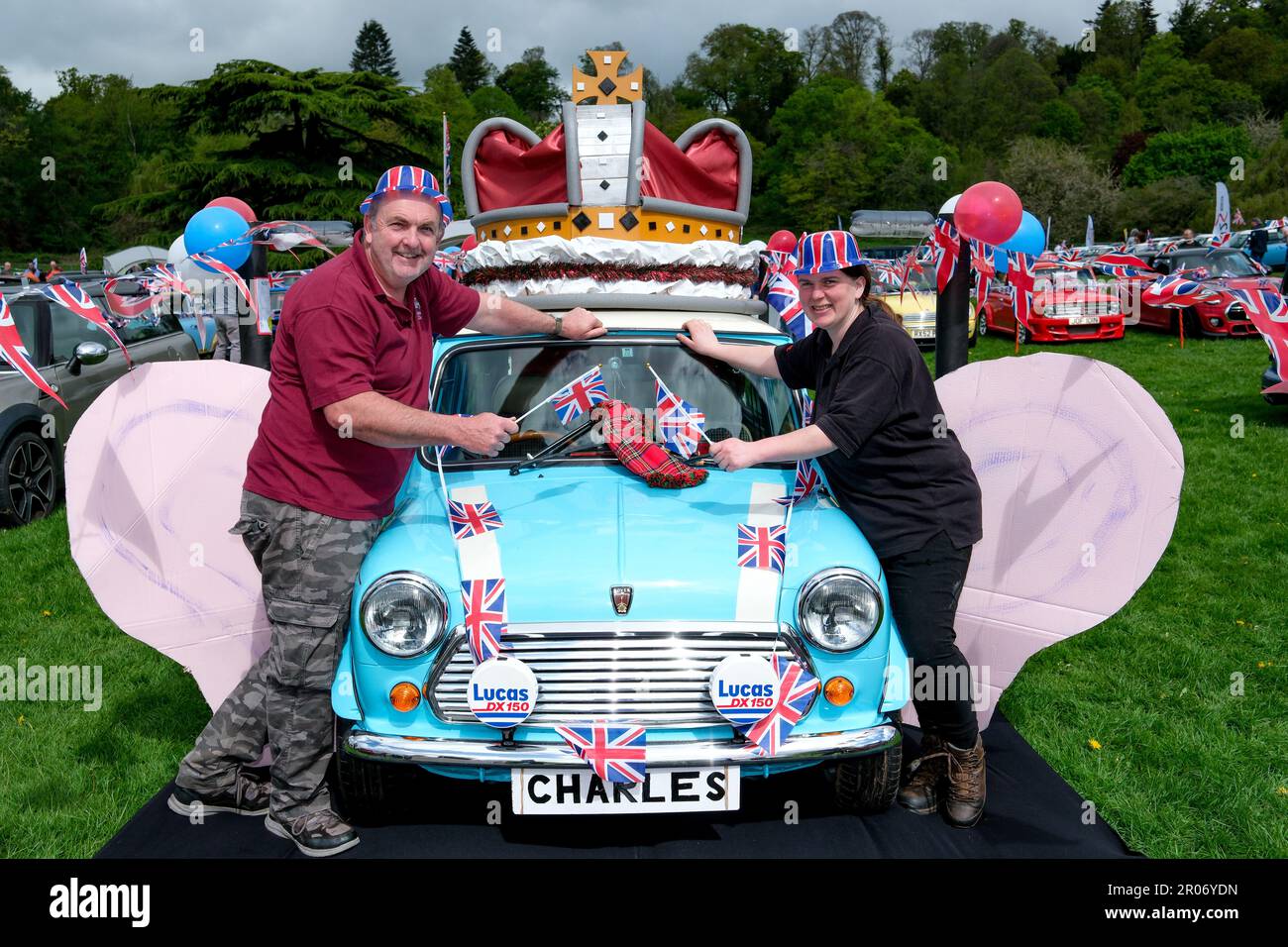 The British Mini Day was held at Himley Hall Nr Dudley, West Midlands, to celebrate the iconic Mini from 1959 to present day. This years show also saw the clib celebrate the Kings Coronation with patriotic themes and displays of Mini”s  past and present. There was also a Royal Mini Picnic in the Park.  Lr Ashley Fellows & Carly Male from Midlands MINI Club   The venue, Himley Hall & Park is an 18th Century building set amongst 180 acres of ‘Capability Brown’ landscaped parkland. For over four centuries it served as home to the Lords of Dudley and their knights. On Sunday 7th May was the 31st B Stock Photo